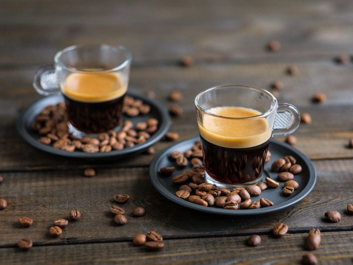 Premium coffee service in a warm café atmosphere